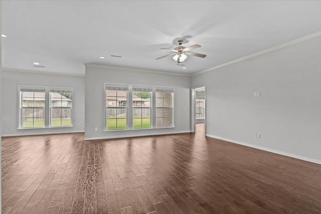 spare room with crown molding, ceiling fan, and dark hardwood / wood-style floors