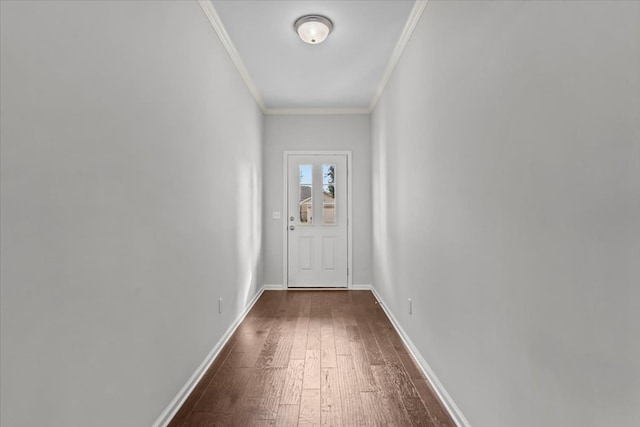 doorway to outside with crown molding and dark hardwood / wood-style floors