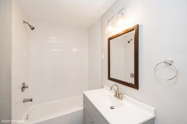 bathroom featuring vanity and tiled shower / bath combo