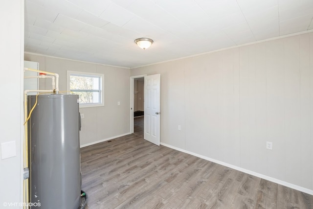 utility room featuring water heater