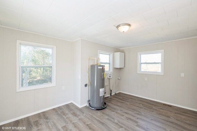 utility room featuring water heater