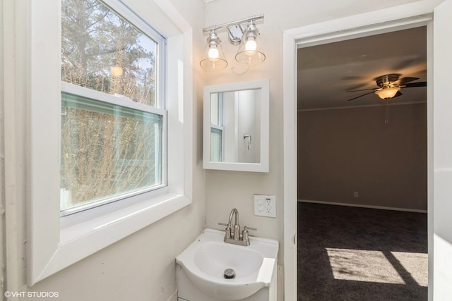 bathroom with plenty of natural light, ceiling fan, and sink