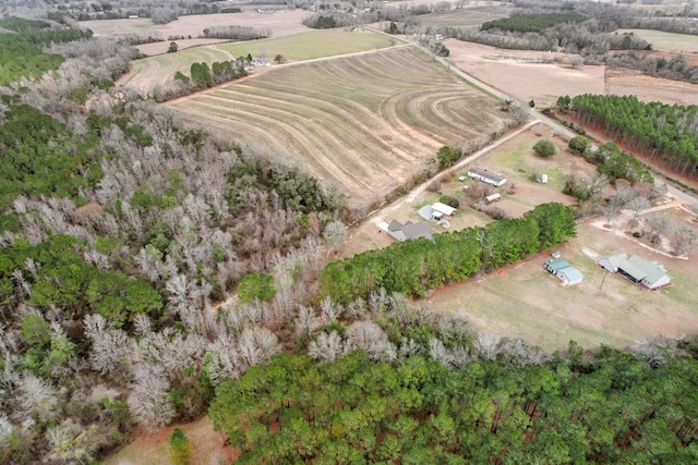 birds eye view of property with a rural view