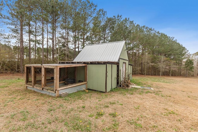 view of outdoor structure featuring a lawn