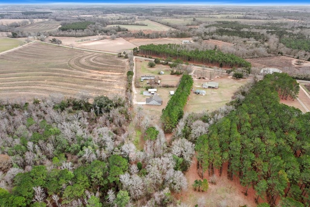 birds eye view of property with a rural view