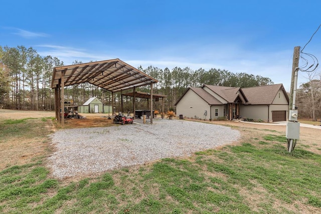 exterior space with a carport and a garage