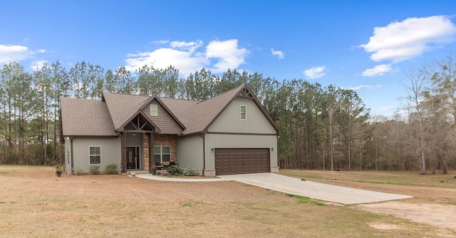 view of front of home with a garage and a front yard