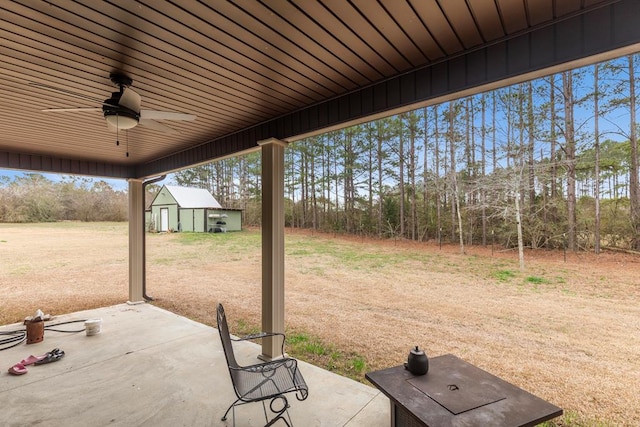 view of patio / terrace with an outdoor structure and ceiling fan