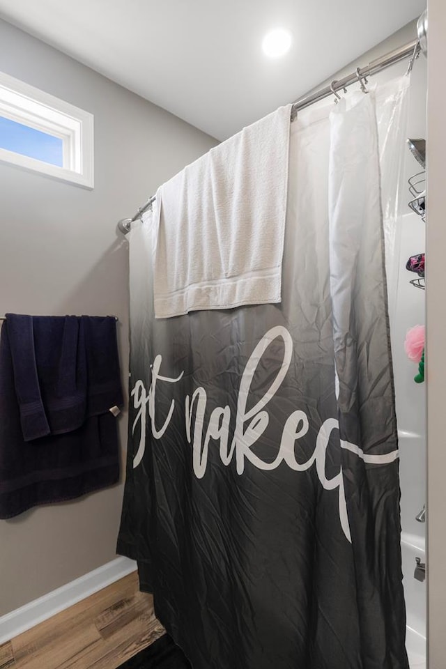 bathroom featuring a shower with curtain and wood-type flooring