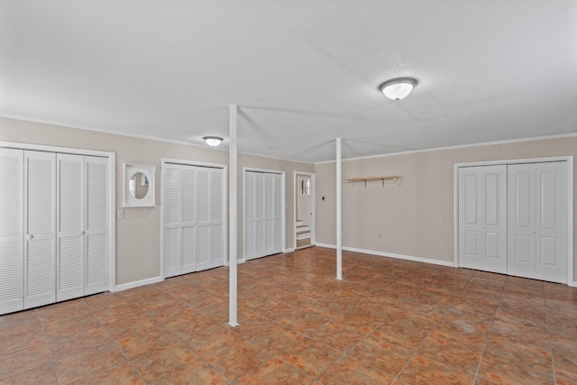 basement featuring crown molding and a textured ceiling