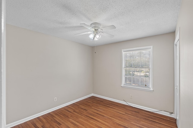 empty room featuring hardwood / wood-style floors, a textured ceiling, and ceiling fan