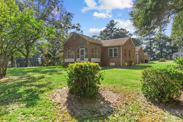 rear view of house with a lawn