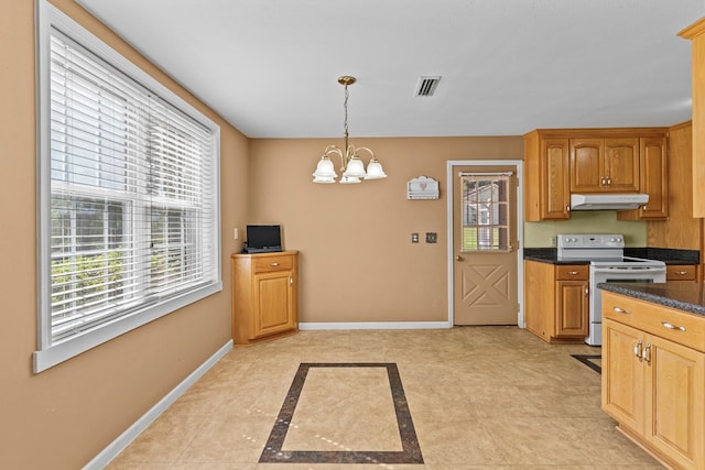 kitchen featuring electric range, pendant lighting, and an inviting chandelier