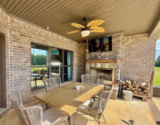 1243 Silcox Rd, Ashford, AL 36312 - view of patio / terrace with an outdoor fireplace, outdoor dining area, and ceiling fan
