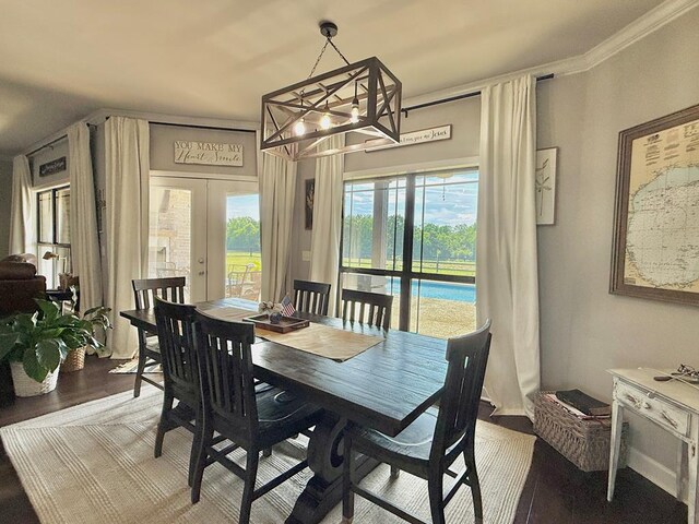 1243 Silcox Rd, Ashford, AL 36312 - dining area featuring french doors, a chandelier, and wood finished floors