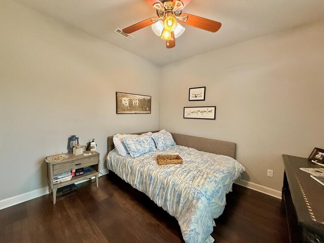 1243 Silcox Rd, Ashford, AL 36312 - bedroom with baseboards, wood finished floors, and a ceiling fan