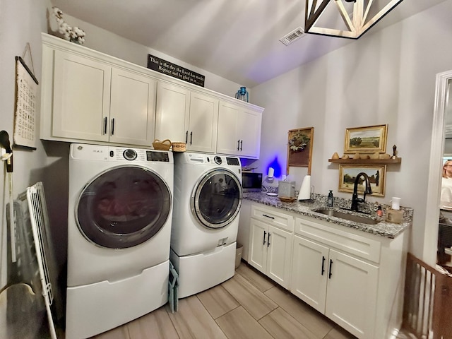 1243 Silcox Rd, Ashford, AL 36312 - washroom featuring cabinet space and washing machine and dryer