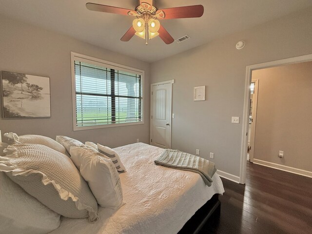 1243 Silcox Rd, Ashford, AL 36312 - bedroom with baseboards, dark wood-style flooring, and ceiling fan