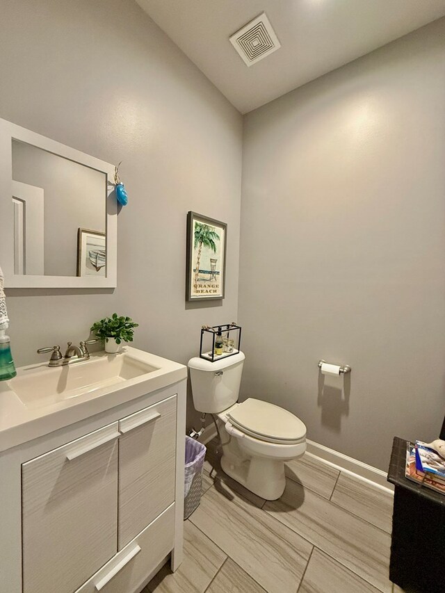 1243 Silcox Rd, Ashford, AL 36312 - bathroom featuring vanity, toilet, and baseboards