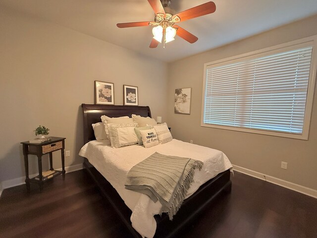 1243 Silcox Rd, Ashford, AL 36312 - bedroom with baseboards, dark wood-style floors, and a ceiling fan