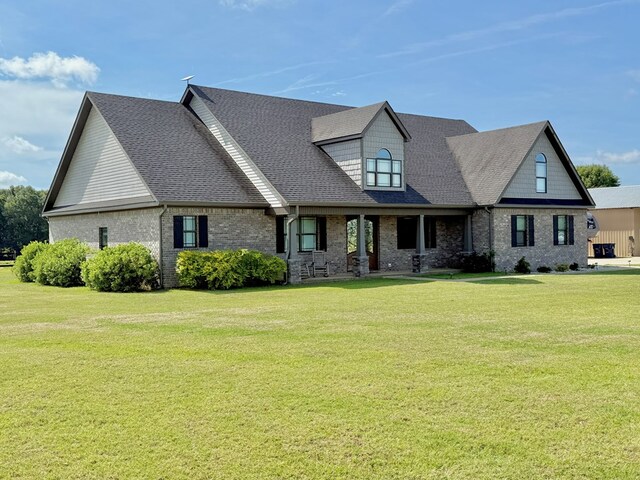 1243 Silcox Rd, Ashford, AL 36312 - view of front of house with a front yard, brick siding, and roof with shingles