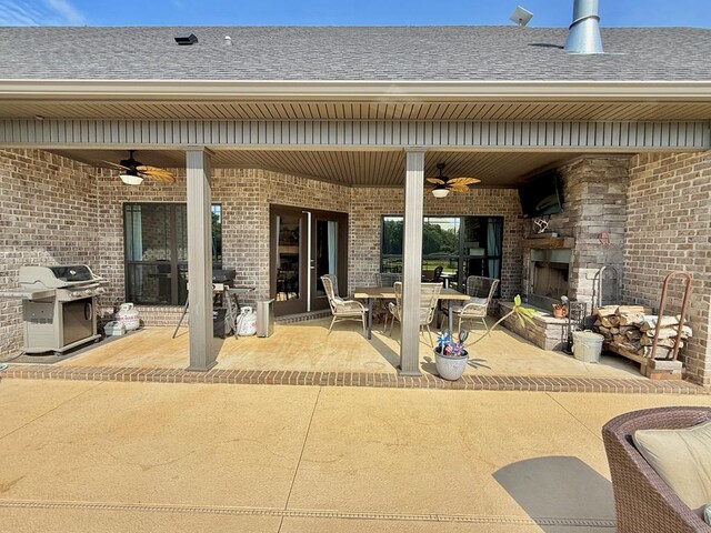 1243 Silcox Rd, Ashford, AL 36312 - view of patio / terrace with an outdoor fireplace, ceiling fan, grilling area, and outdoor dining space