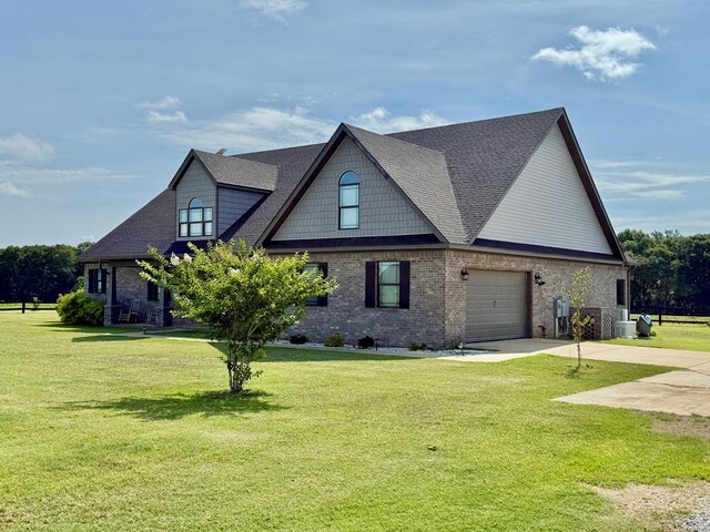 1243 Silcox Rd, Ashford, AL 36312 - view of front of property featuring driveway, a shingled roof, a front yard, and brick siding