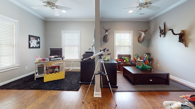 home office with dark hardwood / wood-style flooring and crown molding