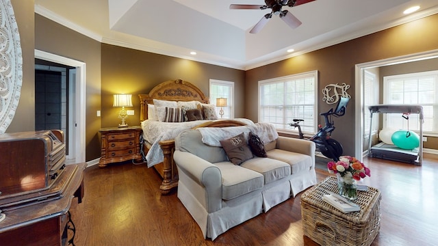 bedroom with ceiling fan, dark hardwood / wood-style flooring, crown molding, and multiple windows