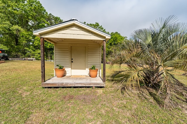 view of outbuilding with a yard