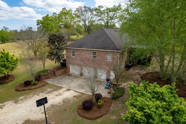 view of property exterior with central AC and a garage