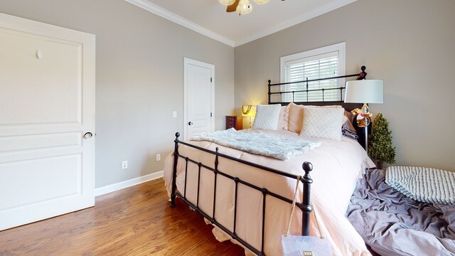 bedroom with ceiling fan, ornamental molding, and hardwood / wood-style flooring