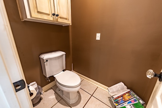 bathroom with tile patterned flooring and toilet