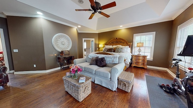 bedroom with ceiling fan, crown molding, and dark wood-type flooring