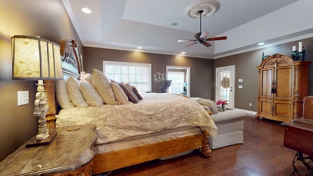 bedroom featuring ceiling fan, dark hardwood / wood-style floors, crown molding, and access to outside