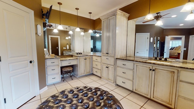 bathroom with tile patterned floors, ceiling fan, sink, and ornamental molding