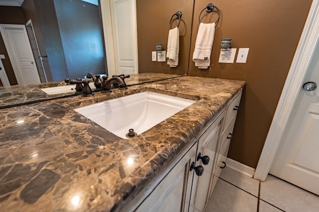 bathroom featuring tile patterned flooring and vanity