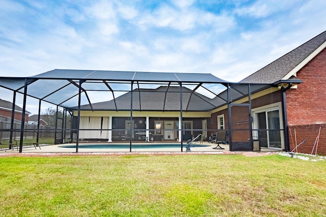 back of house featuring a lawn and glass enclosure