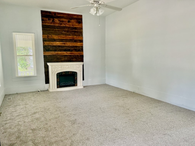 403 W Main St, Samson, AL 36477 - unfurnished living room featuring carpet, ceiling fan, and a fireplace