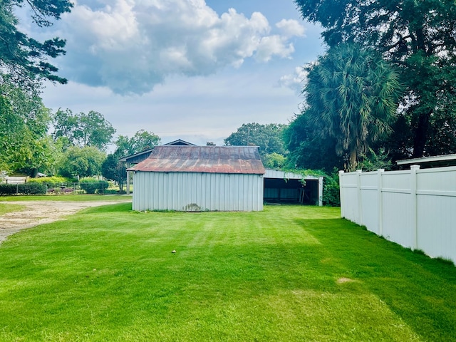 403 W Main St, Samson, AL 36477 - view of yard featuring an outbuilding, an outdoor structure, and driveway