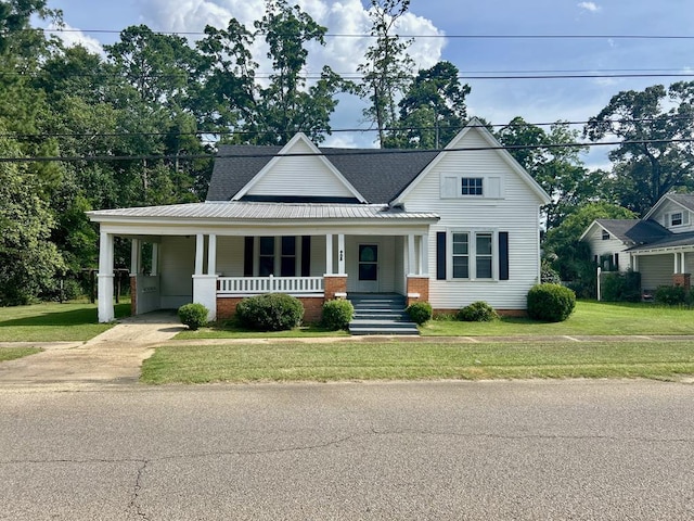 403 W Main St, Samson, AL 36477 - view of front of house featuring covered porch, a front lawn, driveway, and an attached carport