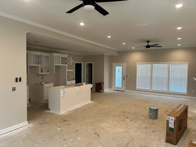 unfurnished living room with recessed lighting, baseboards, a ceiling fan, and ornamental molding