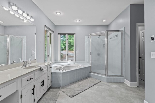 full bathroom with a garden tub, a stall shower, recessed lighting, and vanity