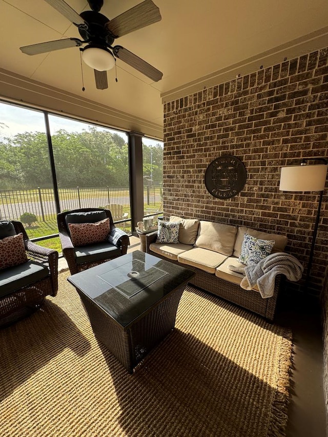 sunroom featuring outdoor lounge area and ceiling fan