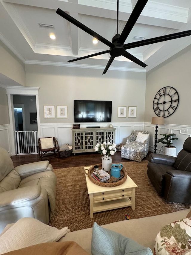 living area with ceiling fan, coffered ceiling, ornamental molding, beam ceiling, and visible vents