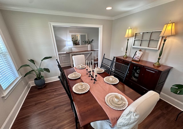 dining room with baseboards, ornamental molding, wood finished floors, and recessed lighting