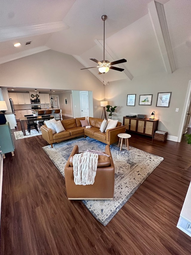 living area featuring visible vents, a ceiling fan, baseboards, lofted ceiling with beams, and dark wood finished floors