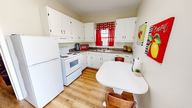 kitchen featuring white cabinetry, white appliances, light hardwood / wood-style floors, and sink