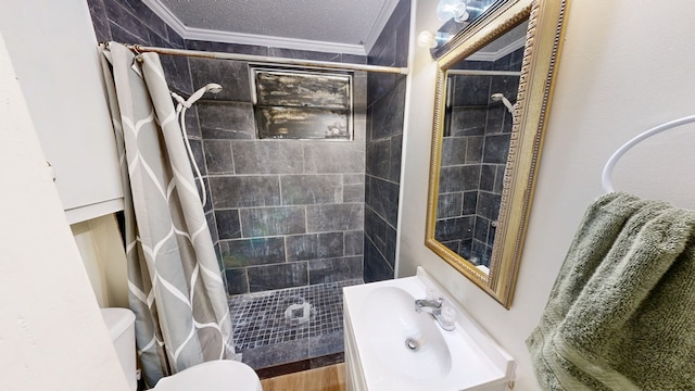 bathroom featuring walk in shower, toilet, sink, crown molding, and a textured ceiling