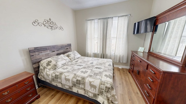 bedroom featuring light wood-type flooring